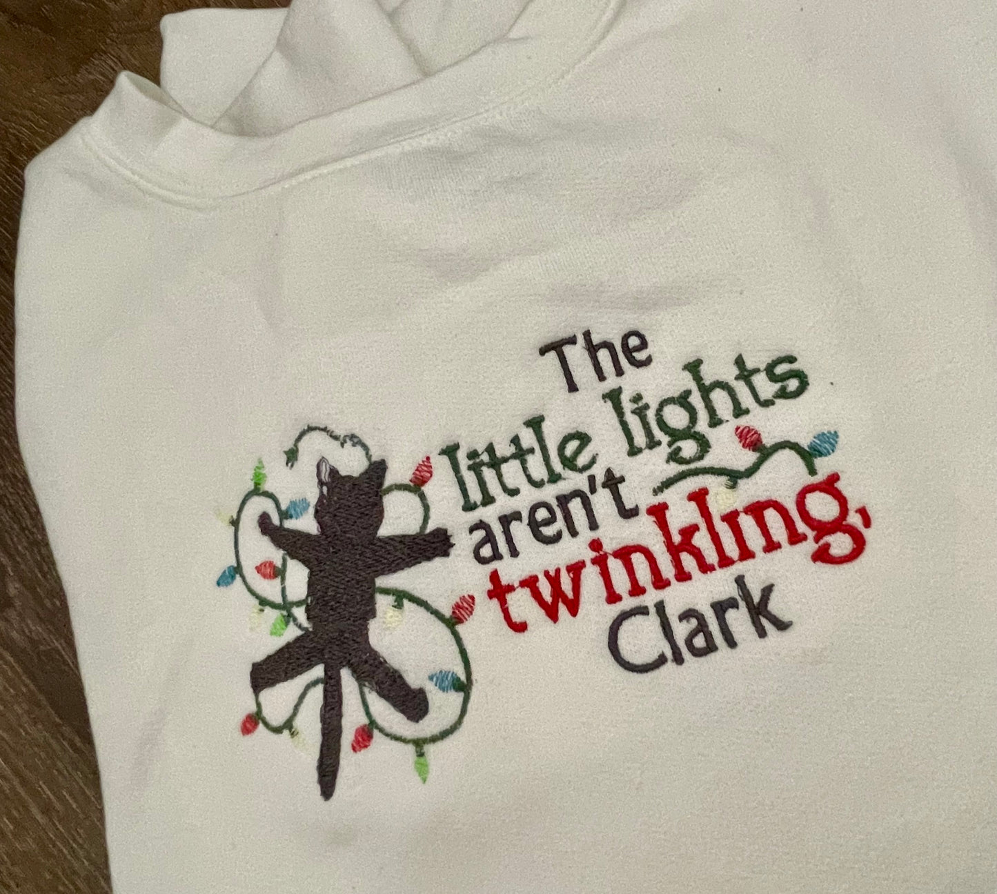 The little lights aren't twinkling, Clark Holiday Embroidered Sweatshirt