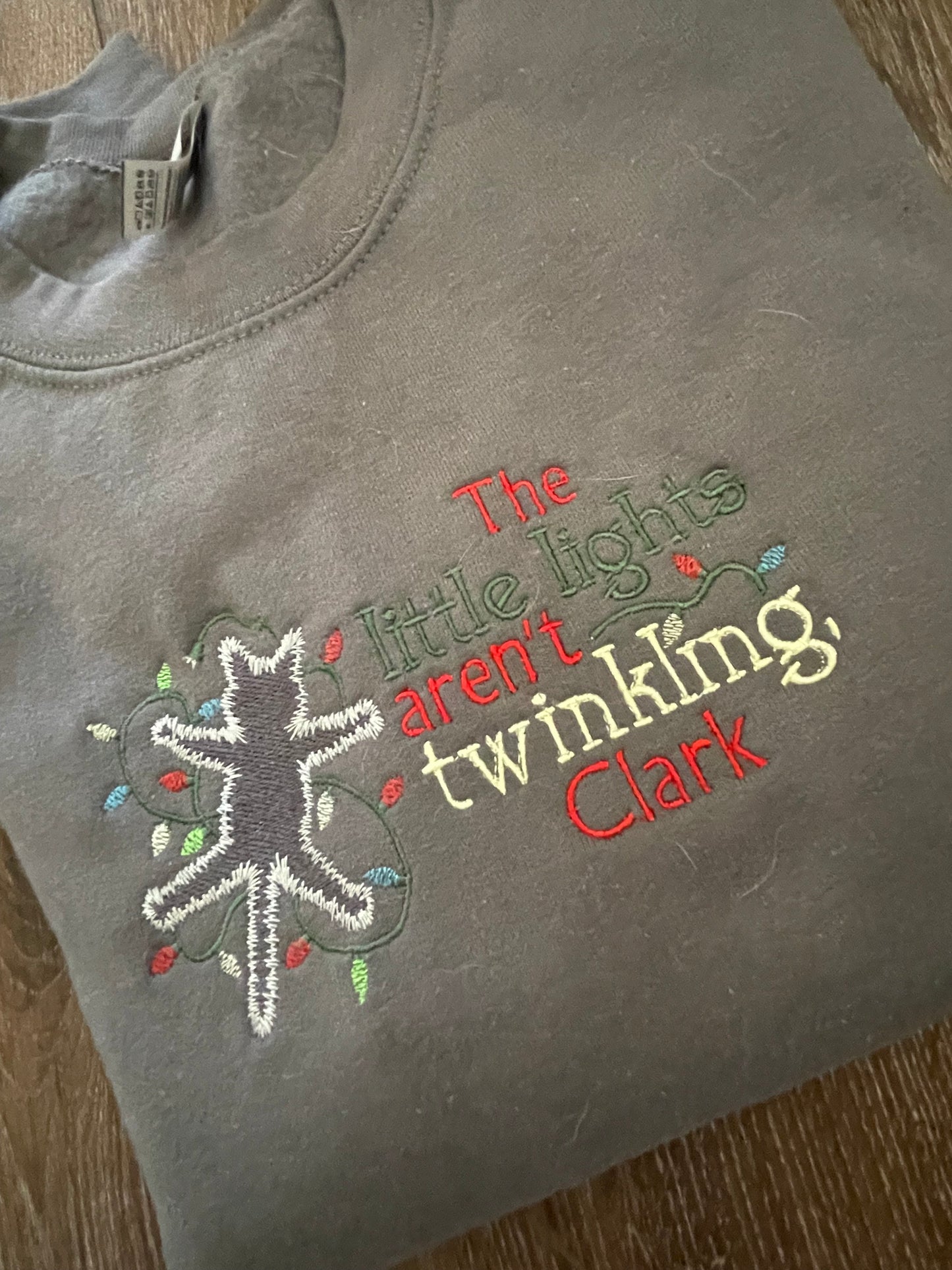 The little lights aren't twinkling, Clark Holiday Embroidered Sweatshirt