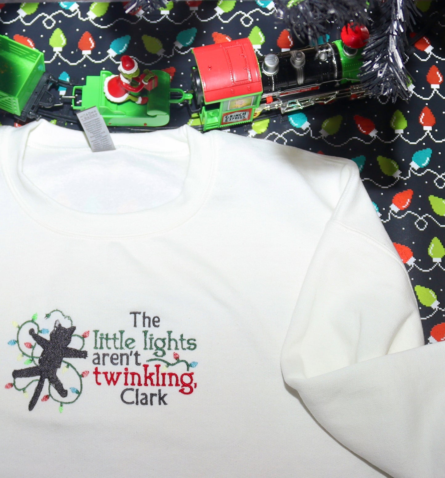 The little lights aren't twinkling, Clark Holiday Embroidered Sweatshirt